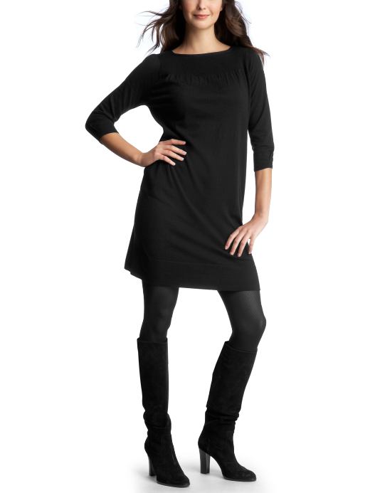 sweater dress with boots and tights.leggings