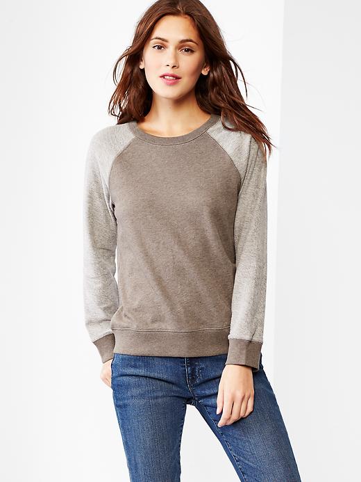 View large product image 1 of 1. Reverse terry raglan sweatshirt