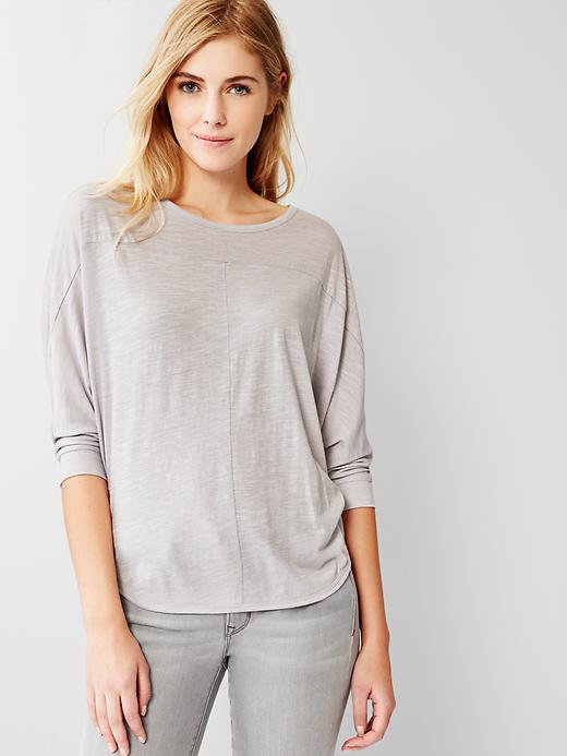 View large product image 1 of 1. Dolman-sleeve shirttail tee