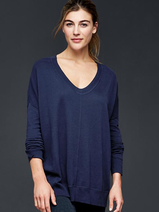 View large product image 1 of 1. Shirttail pullover sweater