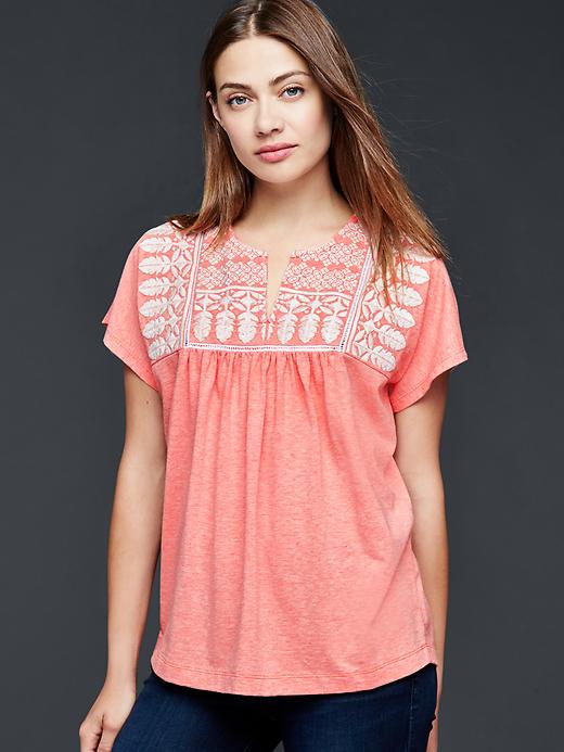 View large product image 1 of 1. Embroidered flutter top