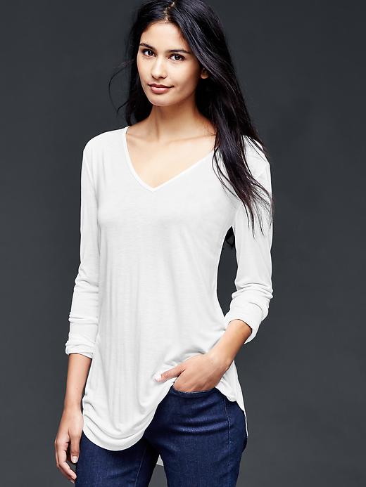 View large product image 1 of 1. Shirttail V-neck top