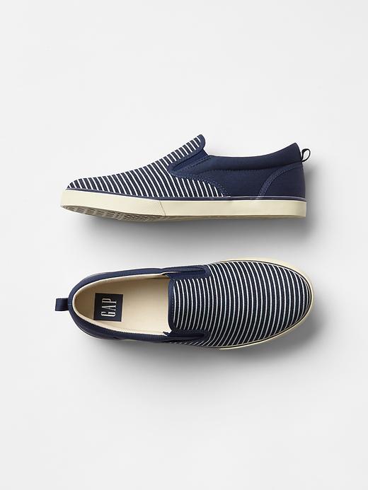View large product image 1 of 1. Railroad stripe slip-on sneakers