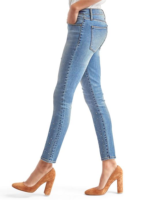 Image number 5 showing, Mid rise gem-studded true skinny jeans