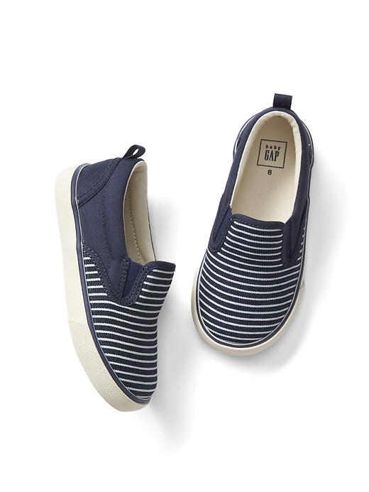 View large product image 1 of 1. Railroad stripe slip-on sneakers