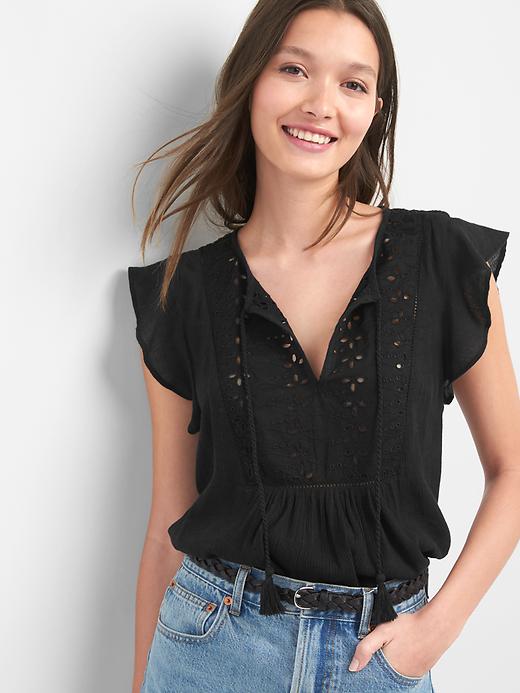 View large product image 1 of 1. Eyelet flutter top