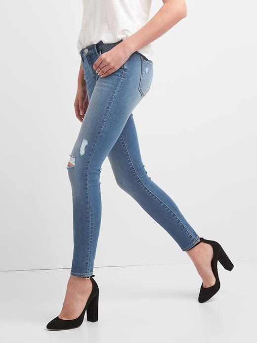 Image number 5 showing, Low Rise True Skinny Jeans with Destruction