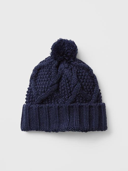 View large product image 1 of 1. Festive pom-pom honeycomb beanie