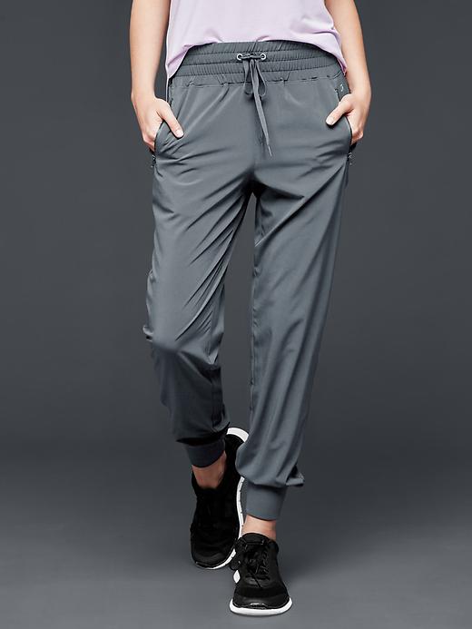1 of 8 showing, with the color gun powder of product GapFit woven studio joggers