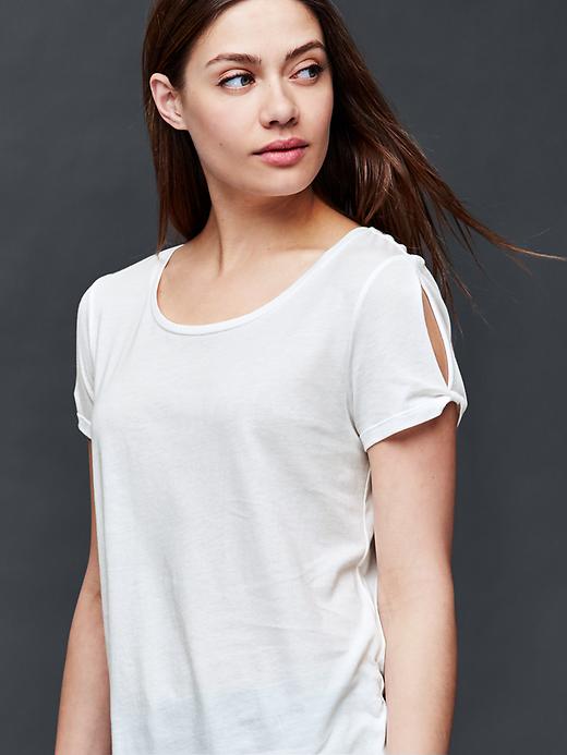 1 of 8 showing, with the color new off white of product Twist short sleeve top