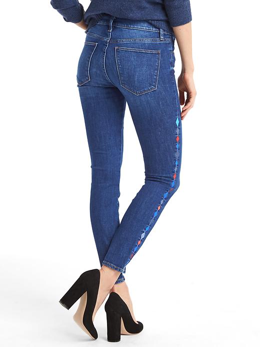 2 of 8 showing, with the color deep blue indigo of product AUTHENTIC 1969 embroidered true skinny ankle jeans