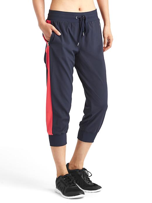 1 of 8 showing, with the color true indigo of product Studio zip joggers