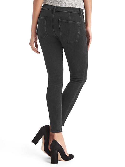 2 of 8 showing, with the color black of product Mid rise zip pocket true skinny ankle jeans