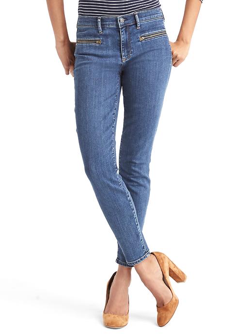 1 of 8 showing, with the color dark indigo of product Mid rise zip pocket true skinny ankle jeans
