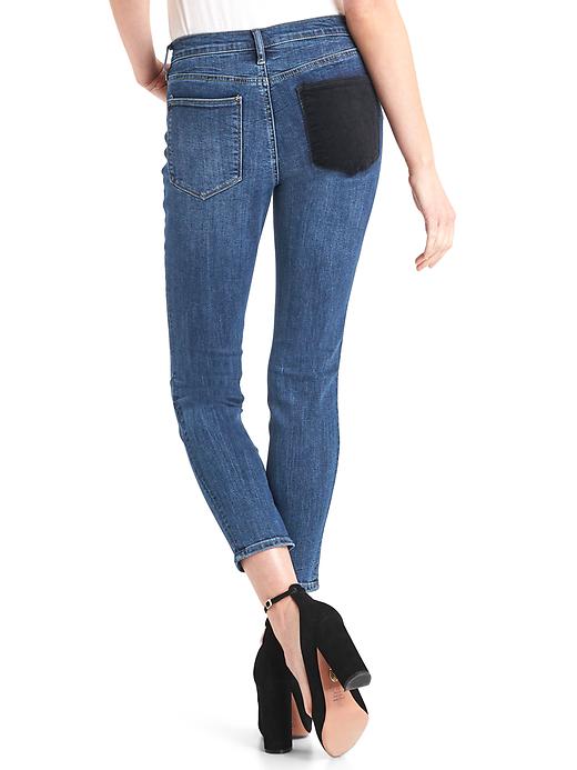 2 of 8 showing, with the color medium indigo of product Mid rise velvet patch true skinny jeans
