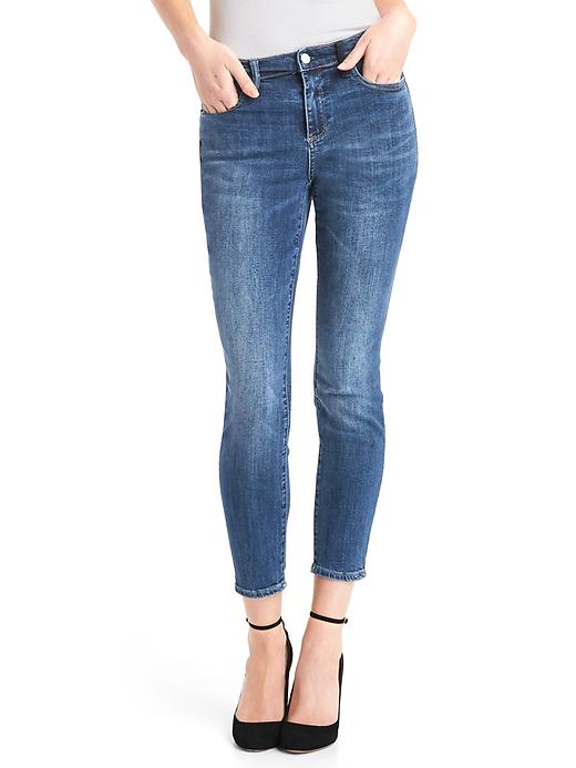 1 of 8 showing, with the color medium indigo of product Mid rise velvet patch true skinny jeans