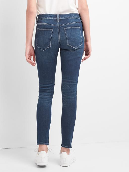 2 of 8 showing, with the color (Dark) Distressed Indigo of product Mid Rise Favorite Ankle Jeggings with Destruction