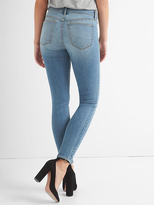 2 of 8 showing, with the color (Medium) Medium Destroy of product Mid Rise True Skinny Curvy Jeans