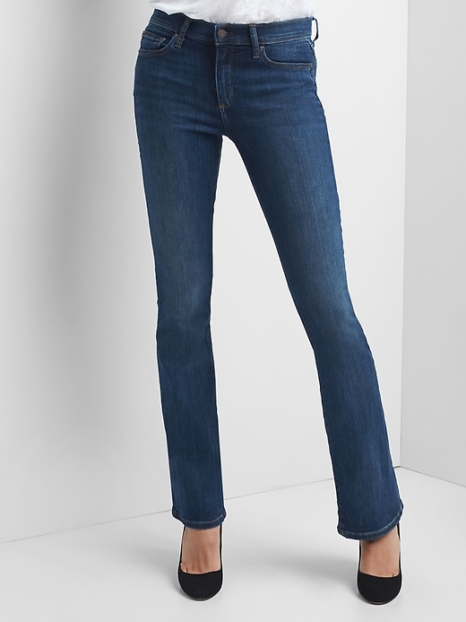 1 of 8 showing, with the color (Medium) Medium Indigo of product Mid Rise Baby Boot Jeans