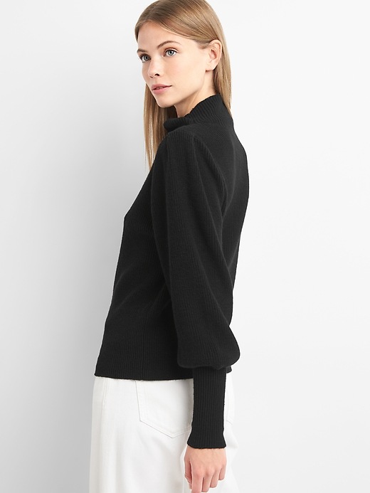 2 of 8 showing, with the color true black of product Merino wool blend balloon sleeve mockneck sweater