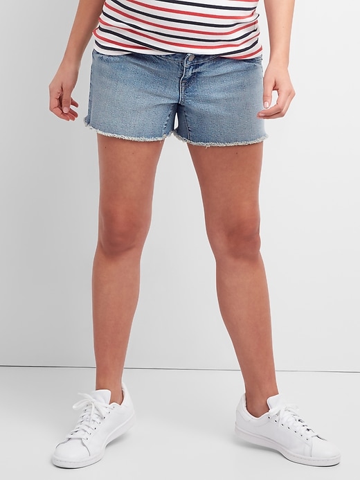 1 of 8 showing, with the color light indigo of product 4" Maternity Inset Panel Denim Shorts with Raw Hem