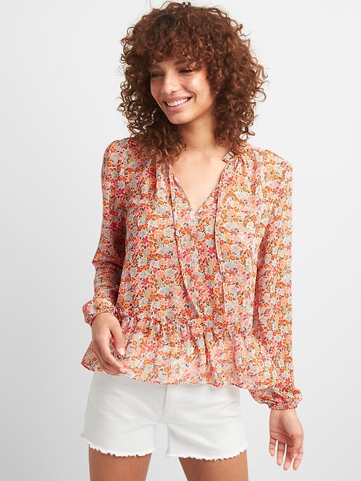 View large product image 1 of 1. Ruffle Hem Floral Blouse