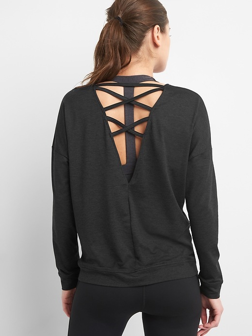 1 of 8 showing, with the color true black of product GapFit Cross-Back Sweatshirt in Brushed Jersey