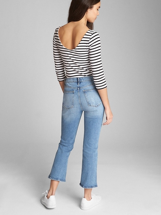 2 of 8 showing, with the color (Light) Light Indigo of product High Rise Crop Kick Jeans with Distressed Detail
