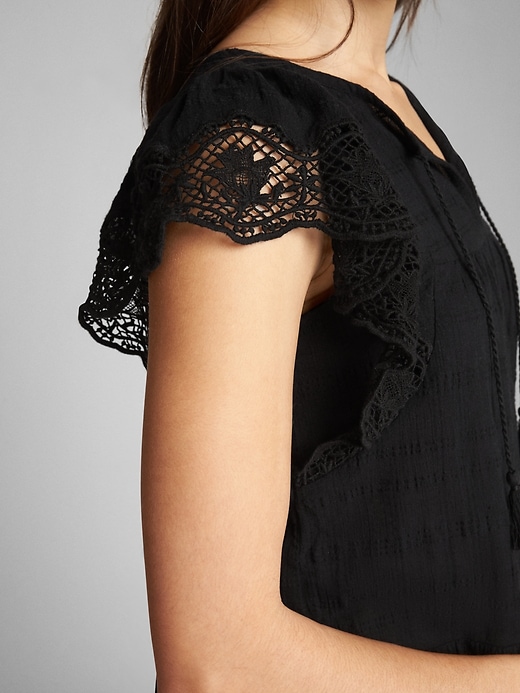 View large product image 1 of 1. Short Sleeve Flutter Crochet Smock Top