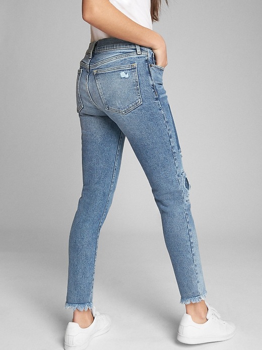 2 of 8 showing, with the color (Medium) Medium Indigo of product Mid Rise True Skinny Ankle Jeans with Laser-Patch Detail