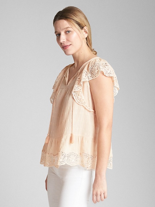 View large product image 1 of 1. Short Sleeve Flutter Crochet Smock Top