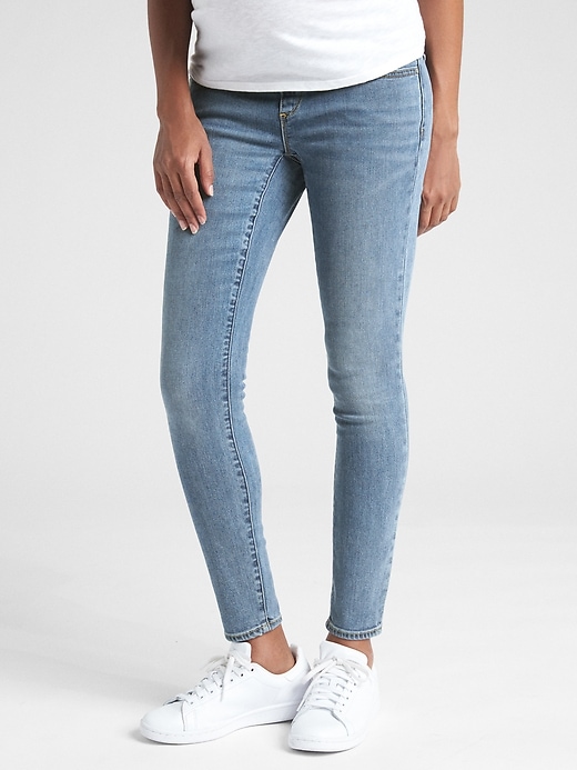 1 of 8 showing, with the color medium wash of product Maternity Soft Wear Demi Panel True Skinny Jeans