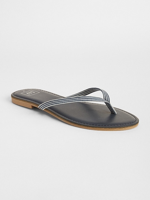 View large product image 1 of 1. Leather print flip flops