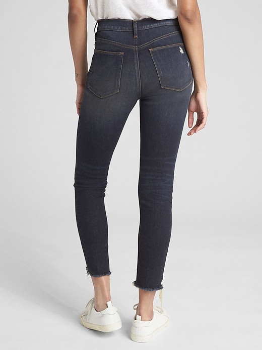 2 of 8 showing, with the color (Dark) Dark Indigo of product High Rise True Skinny Ankle Jeans with Distressed Detail