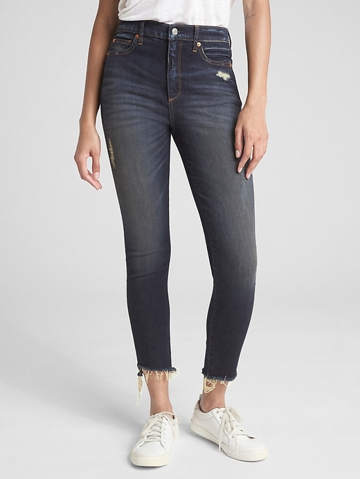 1 of 8 showing, with the color (Dark) Dark Indigo of product High Rise True Skinny Ankle Jeans with Distressed Detail