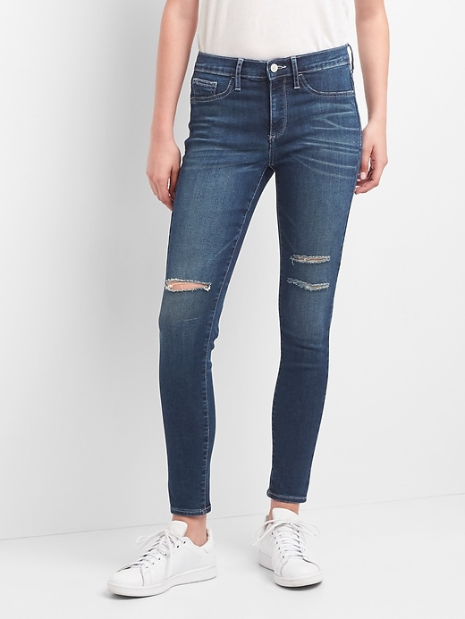 1 of 8 showing, with the color (Dark) Distressed Indigo of product Mid Rise Favorite Ankle Jeggings with Destruction