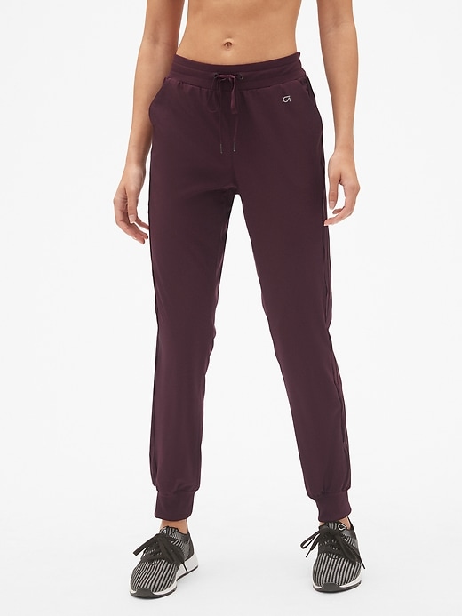 View large product image 1 of 1. GapFit Studio Side-Stripe Joggers