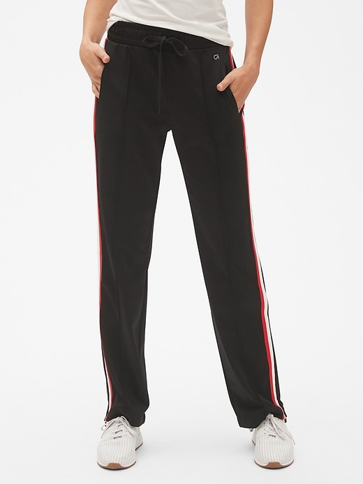 1 of 8 showing, with the color true black of product GapFit Stripe Track Pants