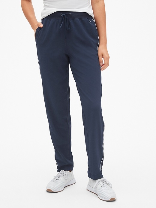 1 of 8 showing, with the color true indigo of product GapFit Side-Stripe Drawstring Pants