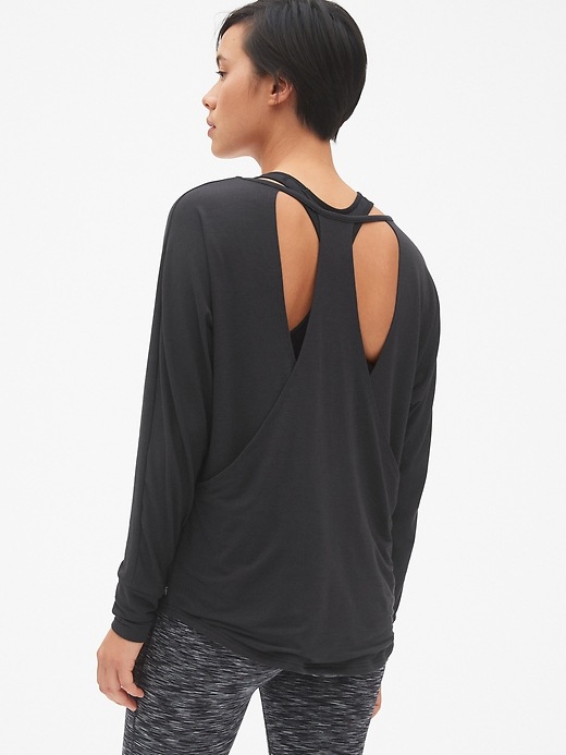 View large product image 1 of 7. GapFit Double-Layer Long Sleeve Cut-Out Top