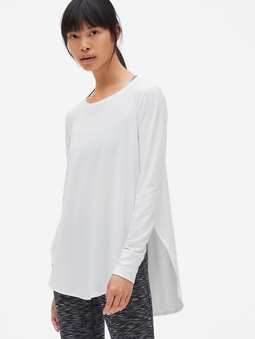 1 of 8 showing, with the color optic white of product GapFit Breathe Hi-Lo Tunic