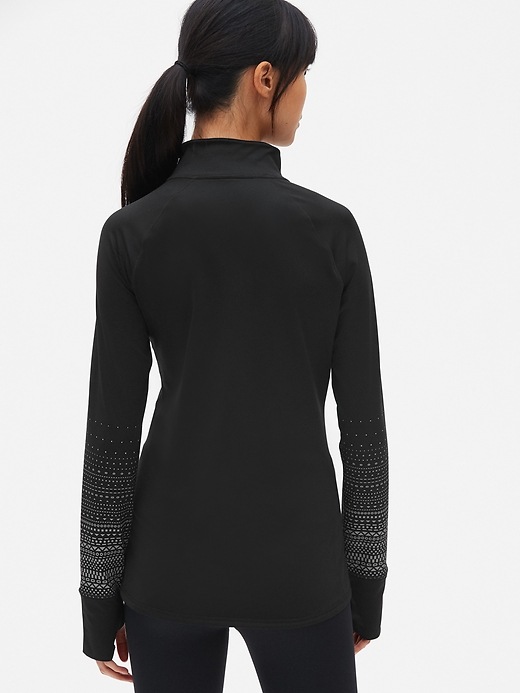 View large product image 2 of 9. GapFit Winterbrush Asymmetrical Half-Zip Reflective Print Pullover