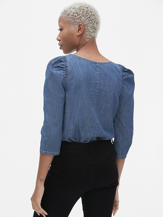 2 of 8 showing, with the color medium wash of product Denim Puff-Sleeve Top