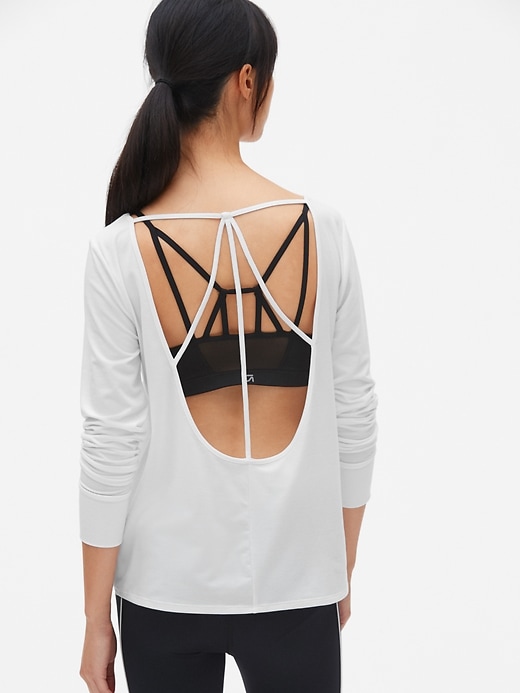 View large product image 1 of 7. GapFit Breathe Long Sleeve Strappy U-Back Top