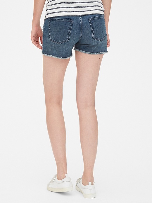 2 of 8 showing, with the color dark wash of product 4" Maternity Full Panel Denim Shorts with Raw Hem