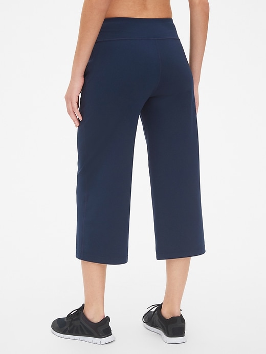 2 of 8 showing, with the color true indigo of product GapFit Studio Wide-Leg Crop Pants in Eclipse