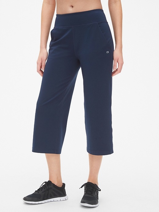 1 of 8 showing, with the color true indigo of product GapFit Studio Wide-Leg Crop Pants in Eclipse