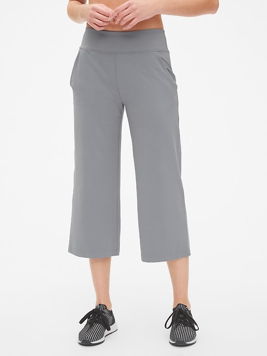 View large product image 1 of 1. GapFit Studio Wide-Leg Crop Pants in Eclipse