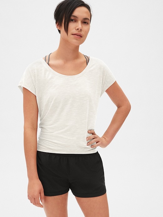 2 of 8 showing, with the color milk of product GapFit Breathe Tie-Back Stripe Detail Top