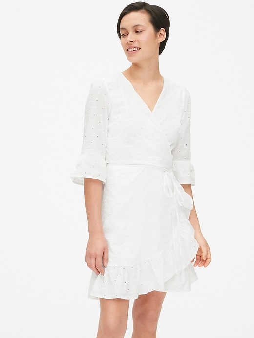 1 of 8 showing, with the color optic white of product Eyelet Embroidered Ruffle Wrap Dress